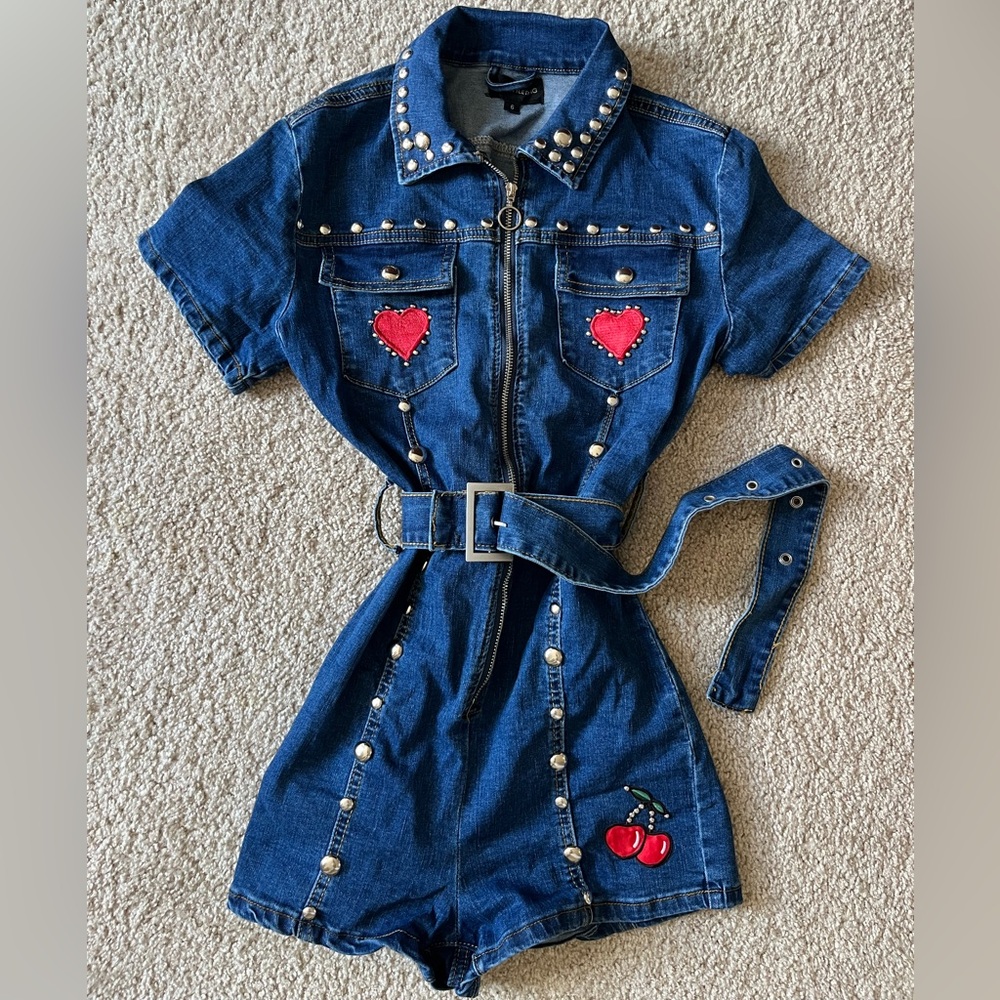 PrettyLittleThing Blue Denim jumpsuit with Red Heart and Stud Details